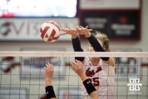 Nebraska Cornhusker Andi Jackson (15) reaches over to block against the South Dakota State Jackrabbits on Saturday, May 3, 2025 in Ord, Nebraska. Photo by John S. Peterson
