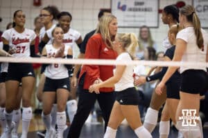 Nebraska Cornhusker head coach Dani Busboom-Kelly giving fives at a break in the action against the South Dakota State Jackrabbits on Saturday, May 3, 2025 in Ord, Nebraska. Photo by John S. Peterson
