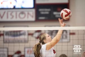 Nebraska Cornhusker Campbell Flynn (4) sets the ball against the South Dakota State Jackrabbits on Saturday, May 3, 2025 in Ord, Nebraska. Photo by John S. Peterson