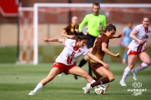 Nebraska Cornhusker Sadie Sant (6) goes for the ball against Wyoming Cowgirl Hadley Linder (8) during a college soccer match Saturday, April 26, 2025, in Lincoln, Nebraska. Photo by Braden Cochran.