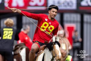 Quinn Clark trying to rope a remote controled steer during Husker games Saturday, April 26, 2025 in Lincoln, Nebraska. Photo by John S. Peterson.