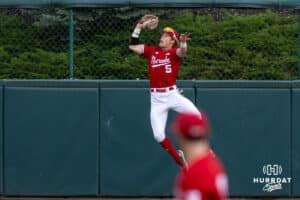 Nebraska Cornhusker outfielder Robby Bolin (5) jumps to make a catch at the wall against the Kansas Jayhawks during a college baseball game Tuesday, April 22, 2025 in Lincoln, Nebraska. Photo by John S. Peterson.