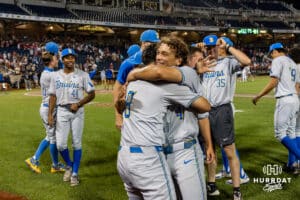 UCLA Bruin Phoenix Call (4) and Kasen Khansarinia (8) hug after the loss to the Arkansas Razorbacks during the College World Series on Tuesday, June 17, 2025 in Omaha, Nebraska. Photo by John S. Peterson.