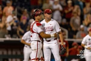 Arkansas Razorback pitcher Will McEntire (41) and catcher Ryder Helfrick (27) celebrates the win over the UCLA Bruins during the College World Series on Tuesday, June 17, 2025 in Omaha, Nebraska. Photo by John S. Peterson.