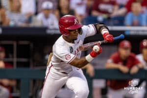 Arkansas Razorback Justin Thomas Jr. (4) with a SAC bunt in the seventh inning against the UCLA Bruins during the College World Series on Tuesday, June 17, 2025 in Omaha, Nebraska. Photo by John S. Peterson.