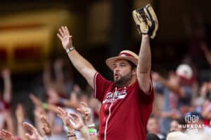 Arkansas Razorbacks fan celebrates a run in the fifith against the UCLA Bruins during the College World Series on Tuesday, June 17, 2025 in Omaha, Nebraska. Photo by John S. Peterson.