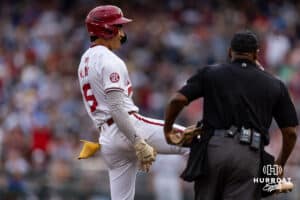 Arkansas Razorback infielder Wehiwa Aloy (9) tripled in the fifth against the UCLA Bruins during the College World Series on Tuesday, June 17, 2025 in Omaha, Nebraska. Photo by John S. Peterson.