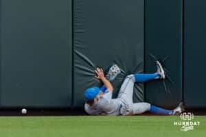 UCLA Bruin outfielder Payton Brennan (11) slides in the wall going after the ball against the Arkansas Razorbacks in the fifth inning during the College World Series on Tuesday, June 17, 2025 in Omaha, Nebraska. Photo by John S. Peterson.