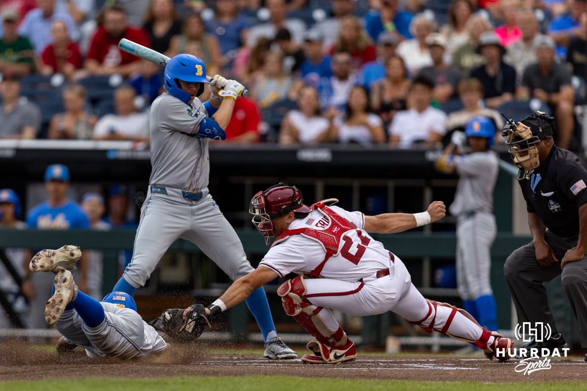 2025 College World Series Arkansas v UCLA| 2025-06-17 Arkansas Razorback catcher Ryder Helfrick (27) tags UCLA Bruin outfielder Dean West (36) out at home in the first inning during the College World Series on Tuesday, June 17, 2025 in Omaha, Nebraska. Photo by John S. Peterson.