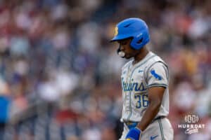 UCLA Bruin outfielder Dean West (36) blows a bubble after hititng a single in the first inning against the UCLA Bruins during the College World Series on Tuesday, June 17, 2025 in Omaha, Nebraska. Photo by John S. Peterson.