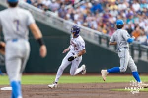 LSU Tiger outfielder Ethan Frey (16) crosses second base as he advances to third in the first inning against the UCLA Bruins during the College World Series on Monday, June 16, 2025 in Omaha, Nebraska. Photo by John S. Peterson.