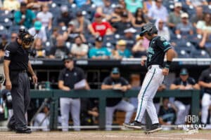 Coastal Carolina Chanticleer infielder Blake Barthol (7) scores a run in the sixth inning against the Louisville Cardinals during the College World Series on Wednesday, June 18, 2025 in Omaha, Nebraska. Photo by John S. Peterson.