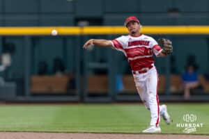 Louisville Cardinal infielder Alex Alicea (0) throws to first for out against the Coastal Carolina Chanticleers in the second inning during the College World Series on Wednesday, June 18, 2025 in Omaha, Nebraska. Photo by John S. Peterson.