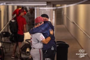 Arkansas Razorback infielder Cam Kozeal (8) hugs his dad after a baseball game on Thursday, June 18th, 2025, in Omaha, Nebraska. Photo by Brandon