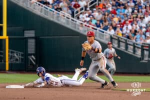 LSU Tiger infielder Daniel Dickinson (14) slides into second base during a baseball game Thursday June 18th 2025 in Omaha Nebraska. Photo by Brandon Tiedemann.