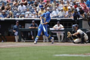 UCLA's Mulivai Levu hits during a game against Murray State on June 14th, 2025 in Omaha, Nebraska. Photo by John Peterson.
