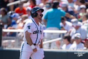 Coastal Carolina Chanticleer outfielder Wells Sykes (20) celebrates scoring a run against the Arizona Wildcats in the eighth inning during the College World Series on Friday, June 13, 2025 in Omaha, Nebraska. Photo by John S. Peterson.