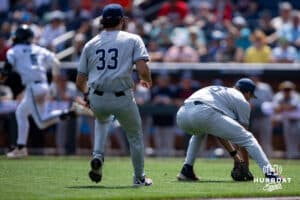 Arizona Wildcat pitcher Casey Hintz (16) scrambles for the bunt to try and throw to first against Coastal Carolina Chanticleer Walker Mitchell (5) during the College World Series on Friday, June 13, 2025 in Omaha, Nebraska. Photo by John S. Peterson.