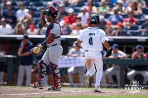 Coastal Carolina Chanticleer infielder Dean Mihos (8) scores a run in the sixth inning against the Arizona Wildcats during the College World Series on Friday, June 13, 2025 in Omaha, Nebraska. Photo by John S. Peterson.