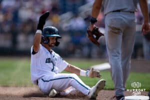 Coastal Carolina Chanticleer infielder Dean Mihos (8) slides to third Arizona Wildcats in the sixth inning during the College World Series on Friday, June 13, 2025 in Omaha, Nebraska. Photo by John S. Peterson.