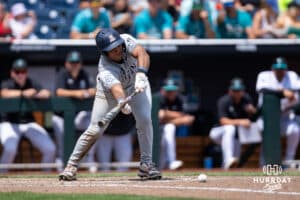 Arizona Wildcat Adonys Guzman (18) bunts for a single against the Coastal Carolina Chanticleers in the fifth inning during the College World Series on Friday, June 13, 2025 in Omaha, Nebraska. Photo by John S. Peterson.