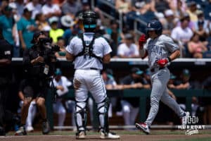 Arizona Wildcat infielder Mason White (24) scores a run hitting a home run in the fourth inning against the Coastal Carolina Chanticleers during the College World Series on Friday, June 13, 2025 in Omaha, Nebraska. Photo by John S. Peterson.