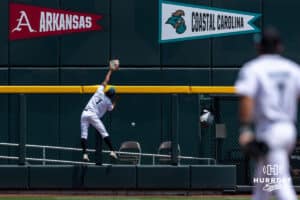 Coastal Carolina Chanticleer outfielder Sebastian Alexander (1) tries to catch the home run hit by Arizona Wildcat Mason White in the fourth inning during the College World Series on Friday, June 13, 2025 in Omaha, Nebraska. Photo by John S. Peterson.