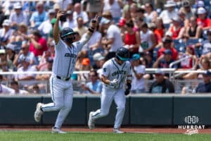 Coastal Carolina Chanticleer first baseman Colby Thorndyke (16) and Coastal Carolina Chanticleer outfielder Blagen Pado (22) celebrate their runs against the Arizona Wildcats as they run to the dugout in the second inning during the College World Series on Friday, June 13, 2025 in Omaha, Nebraska. Photo by John S. Peterson.