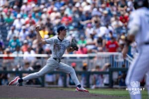 Arizona Wildcat pitcher Owen Kramkowski (17) gets dirty after diving for a ball in the second inning against the Coastal Carolina Chanticleers during the College World Series on Friday, June 13, 2025 in Omaha, Nebraska. Photo by John S. Peterson.