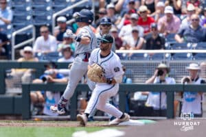 Coastal Carolina Chanticleer first baseman Colby Thorndyke (16) forces out Arizona Wildcat infielder Garen Caulfield (1) in the second inning during the College World Series on Friday, June 13, 2025 in Omaha, Nebraska. Photo by John S. Peterson.