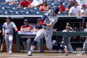 Arizona Wildcat outfielder Brendan Summerhill (4) hits a single against the Coastal Carolina Chanticleers in the first inning during the College World Series on Friday, June 13, 2025 in Omaha, Nebraska. Photo by John S. Peterson.