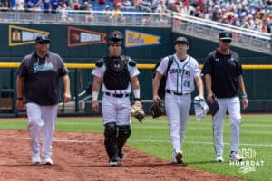 Coastal Carolina Chanticleer catcher Caden Bodine (17) and pitcher Riley Eikhoff (26) walking to dugout for the start of the game against the Arizona Wildcats during the College World Series on Friday, June 13, 2025 in Omaha, Nebraska. Photo by John S. Peterson.