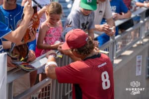 Arkansas Cam Kozeal signs autographs during the CWS Media Day on June 12th, 2025 in Omaha, Nebraska. Photo by Brandon Tiedemann.
