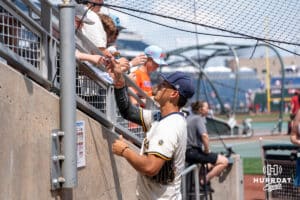 Murray State player signs autographs during the CWS Media Day on June 12th, 2025 in Omaha, Nebraska. Photo by Brandon Tiedemann.