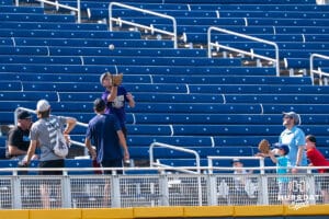 A fan catches a ball during the CWS Media Day on June 12th, 2025 in Omaha, Nebraska. Photo by Brandon Tiedemann.