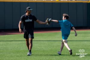 Coastal Carolina fan catches batting practice during the CWS Media Day on June 12th, 2025 in Omaha, Nebraska. Photo by Brandon Tiedemann.