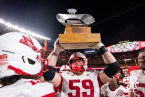 Nebraska Cornhusker Henry Lutovsky (59) hoist the trophy for the Battle Sports Kansas City Classic after the win over the Cincinnati Bearcats during the college football game, Thursday, August 28, 2025 in Kansas City, MO. Photo by John S. Peterson.