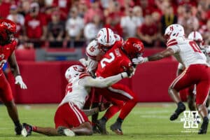Nebraska Cornhuskers Dasan McCullough (15) and Williams Nwaneri (96) tackles Cincinnati Bearcat quarterback Brendan Sorsby (2) in the fourth quarter during a college football game on Thursday, August 28, 2025, in Kansas City, MO. Photo by John S. Peterson.