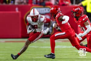 Nebraska Cornhusker Dane Key (6) runs with the ball against Cincinnati Bearcat cornerback Matthew McDoom (0) and Tayden Barnes (10) during a college football game on Thursday, August 28, 2025, in Kansas City, MO. Photo by John S. Peterson.