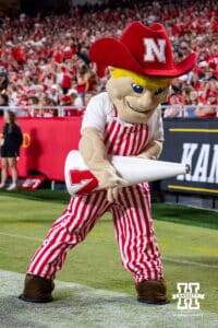 Nebraska Cornhuskers mascot Herbie plays the air guitar at a break in the action during a college football game against the Cincinnati Bearcats Thursday, August 28, 2025 in Kansas City, MO. Photo by John S. Peterson.