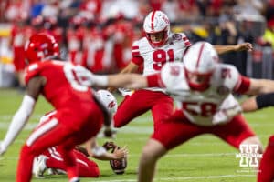 Nebraska Cornhusker Kyle Cunanan (91) makes the extra point against the Cincinnati Bearcats at the end of the end of the second quarter against the Cincinnati Bearcats during a college football game Thursday, August 28, 2025 in Kansas City, MO. Photo by John S. Peterson.