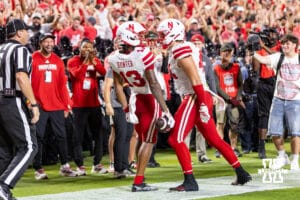 Nebraska Cornhusker Nyziah Hunter (13) celebrates a touchdown with Luke Lindenmeyer (44) in the second quarter against the Cincinnati Bearcats during a college football game Thursday, August 28, 2025 in Kansas City, MO. Photo by John S. Peterson.