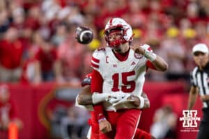 Nebraska Cornhusker Dylan Raiola (15) fumbles the ball after a hit by Cincinnati Bearcat linebacker Jonathan Thompson (22), Dylan recovers the ball for two yare loss, in the second quarter during a college football game Thursday, August 28, 2025 in Kansas City, MO. Photo by John S. Peterson.