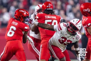 Nebraska Cornhusker Marques Watson-Trent (33) reaches for Cincinnati Bearcat running back Evan Pryor (6) in the first quarter during a college football game on Thursday, August 28, 2025, in Kansas City, MO. Photo by John S. Peterson.