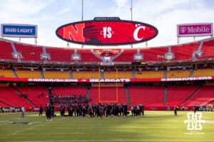 Nebraska Cornhuskers gather at the center of the filed before the college football game against the Cincinnati Bearcats, Thursday, August 28, 2025 in Kansas City, MO. Photo by John S. Peterson.