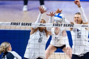 Creighton Bluejay Kiara Reinhardt (5) blocks Penn State Nittany Lion Emmi Sellman (13) with Jaya Johnson (6) in the third set during the AVAC First Serve volleyball match on Saturday, August 23, 2025 in Lincoln, Nebraska. Photo by John S. Peterson.