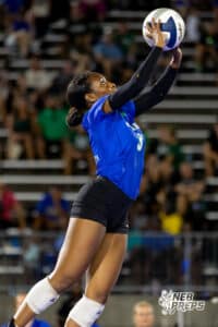 A Millard North player fully extends to get the ball back over the net during the Battle at the Buell, Thursday, August 21st, 2025, Millard, Nebraska. Photo by Braden Cochran.
