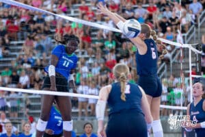 A Millard North player spikes the ball against Millard South during the Battle at Buell, Thursday, August 21st, 2025, Millard, Nebraska. Photo by Braden Cochran.