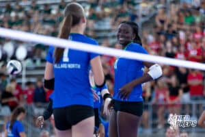 Two Millard North Players talking with each other during the Battle at Buell, Thursday, August 21st, 2025, Millard, Nebraska. Photo by Braden Cochran.