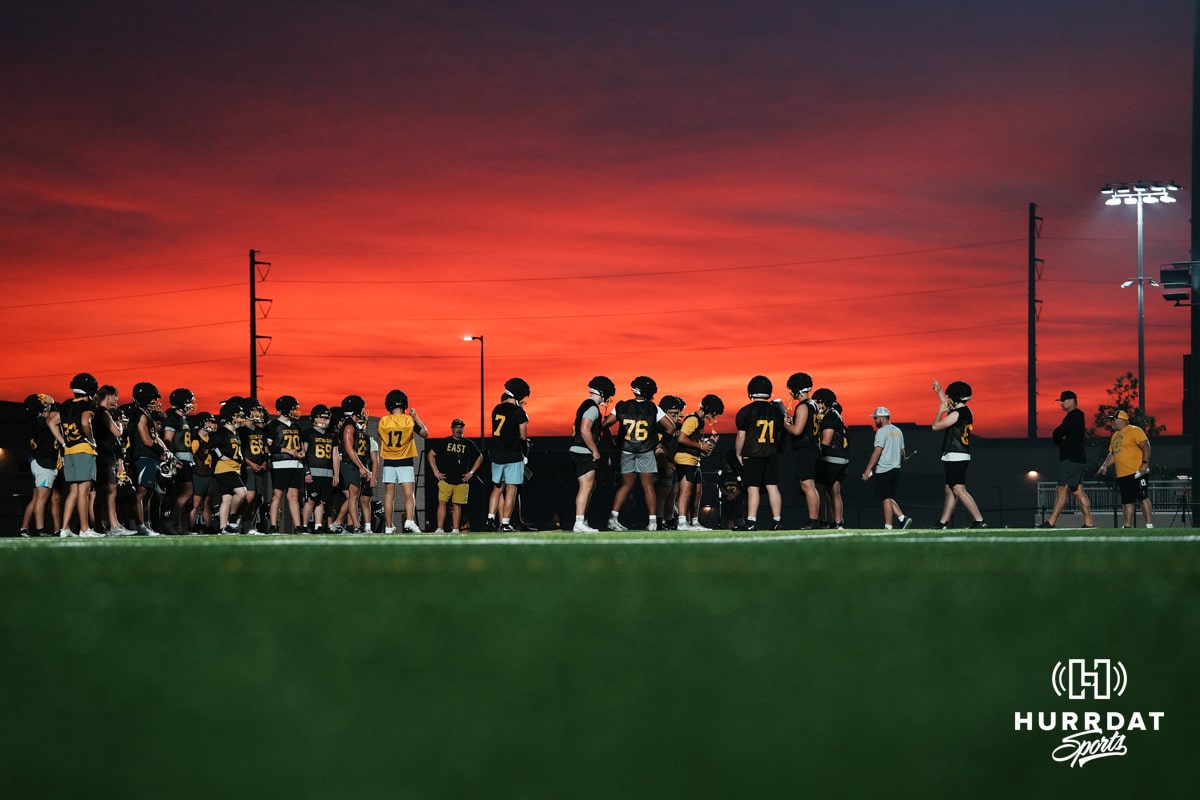 Gretna East is working on running football plays at sunset in Gretna, Nebraska. Photo by Mike Sautter.